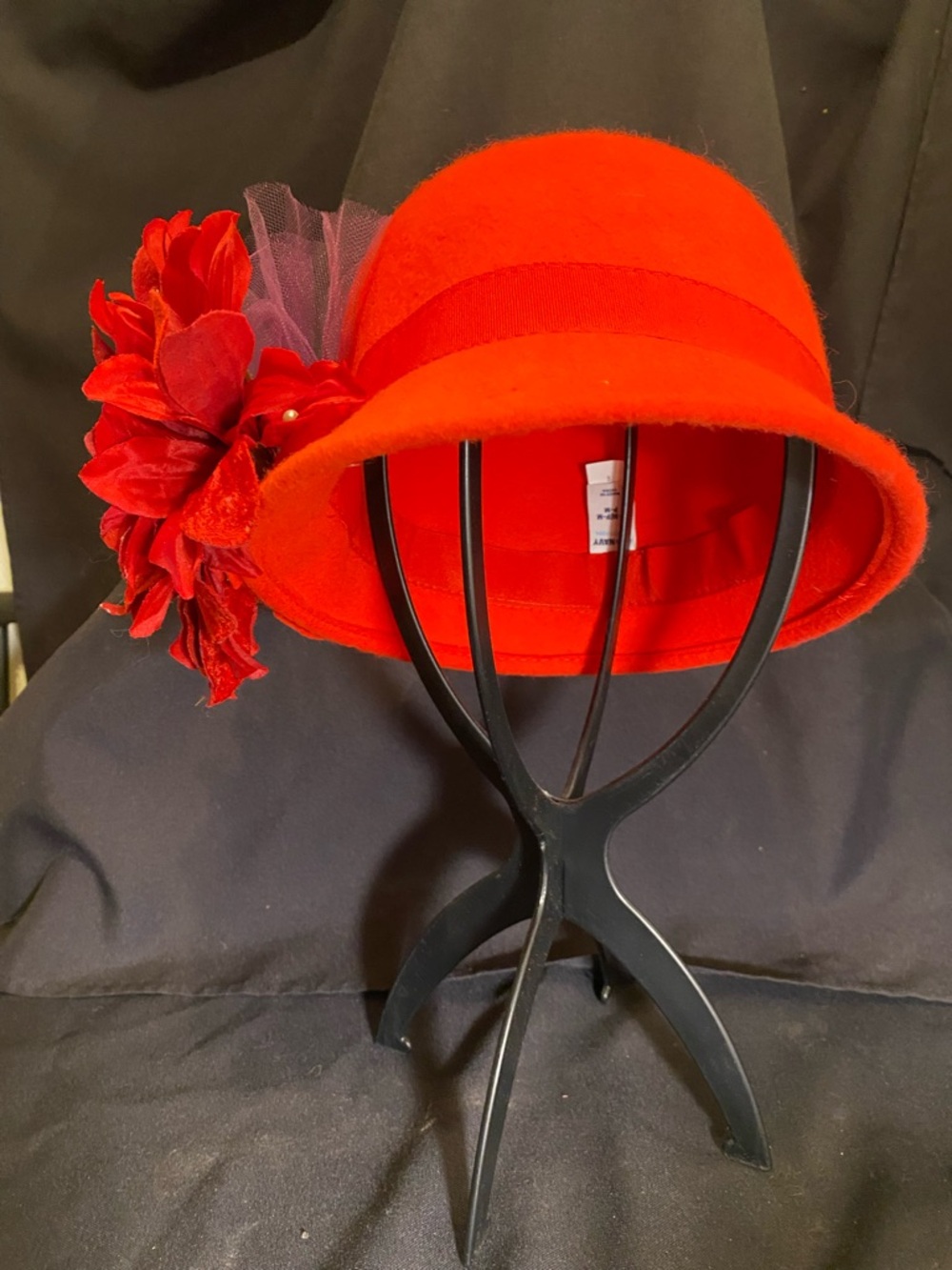 Vintage-style red wool felt cloche hat decorated with removable flower & net.